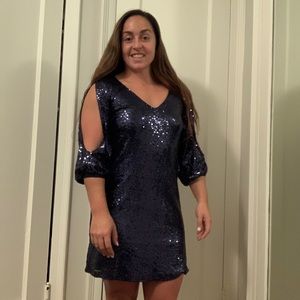 An unforgettable holiday dress from Lulus! Spread the sparkle this season.